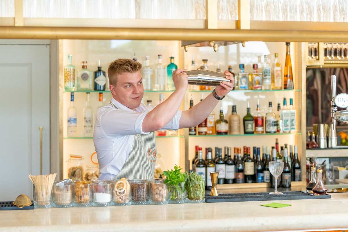 barman making cocktail